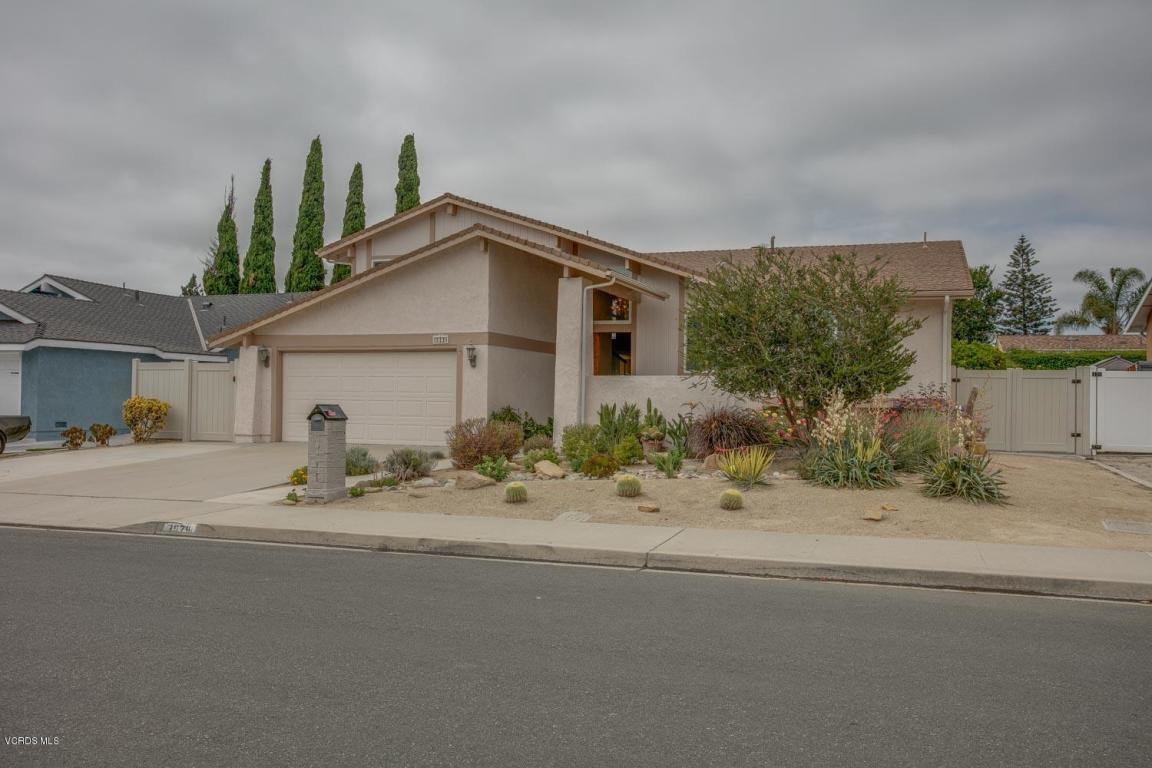 “Single‑family home in Camarillo with drought‑tolerant front yard landscaping, beige exterior, and a two‑car garage on a quiet residential street.”