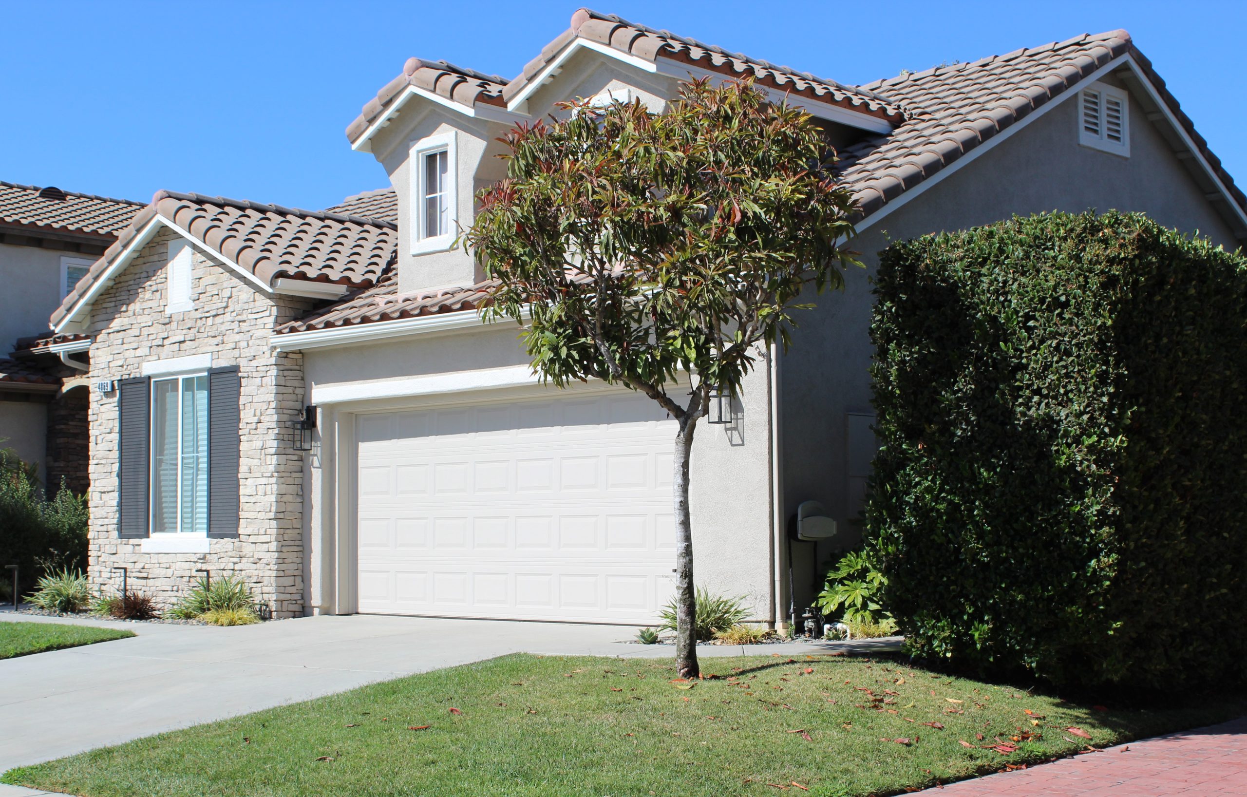 “A peaceful Camarillo neighborhood with tree‑lined streets and mountain views, showcasing the quiet lifestyle remote workers love.”
